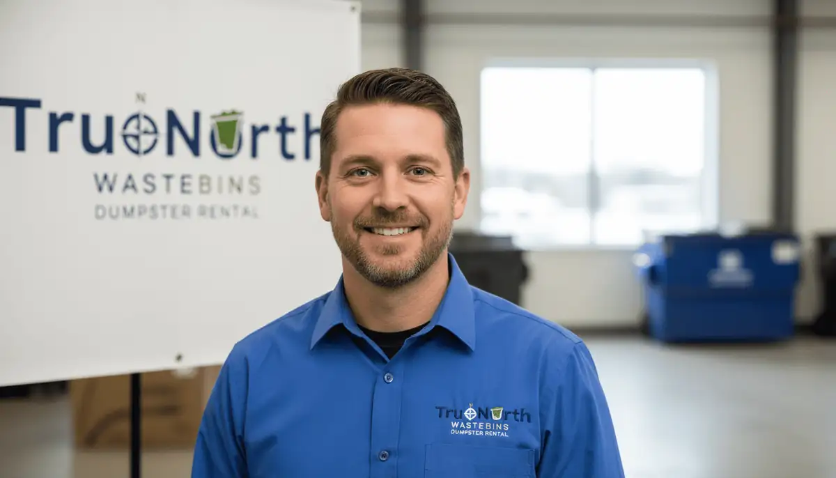 A True North Waste Bins team member in a company shirt in the office